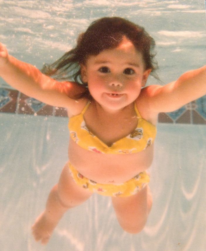 baby girl swimming underwater