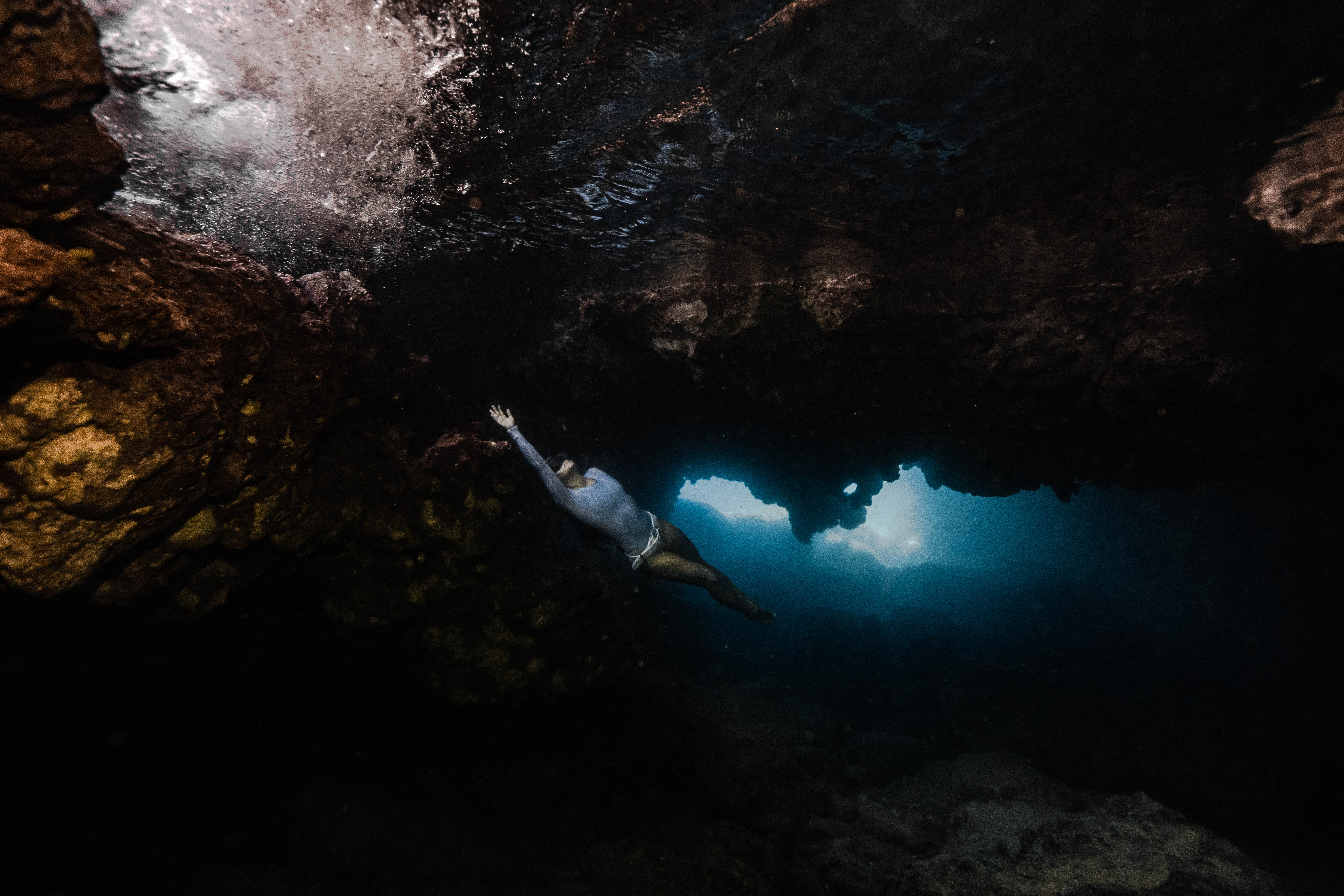 female freediver cave diver underwater